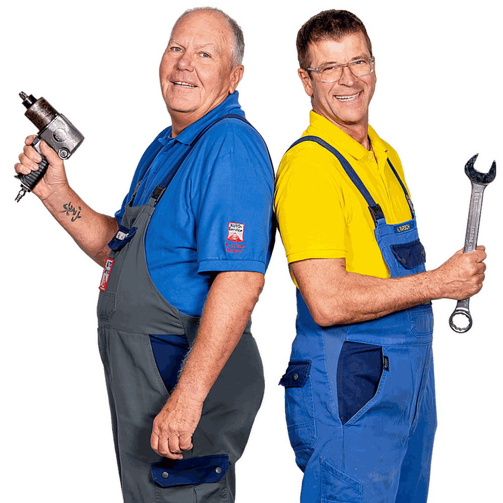 Die Autodoktoren Holger Parsch und Hans-Jürgen Faul im Blaumann mit Werkzeug